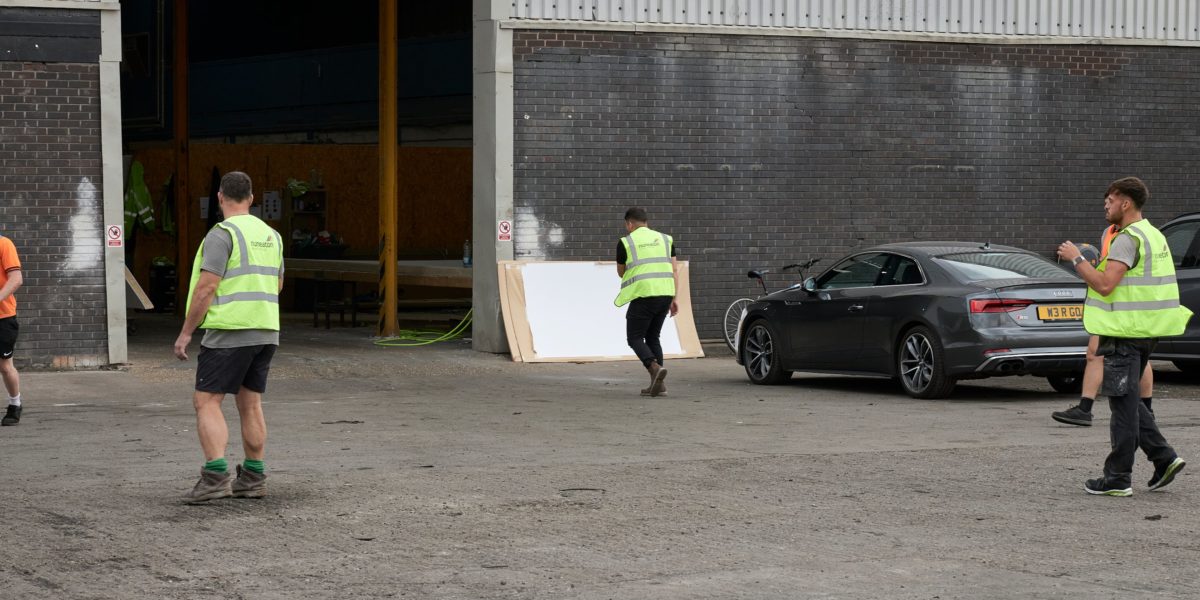 Staff walking into factory